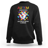 Autism awareness sweatshirt, black crewneck with colorful puzzle-hand graphic and text