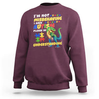 Maroon dinosaur autism sweatshirt with colorful front text and dinosaur graphic