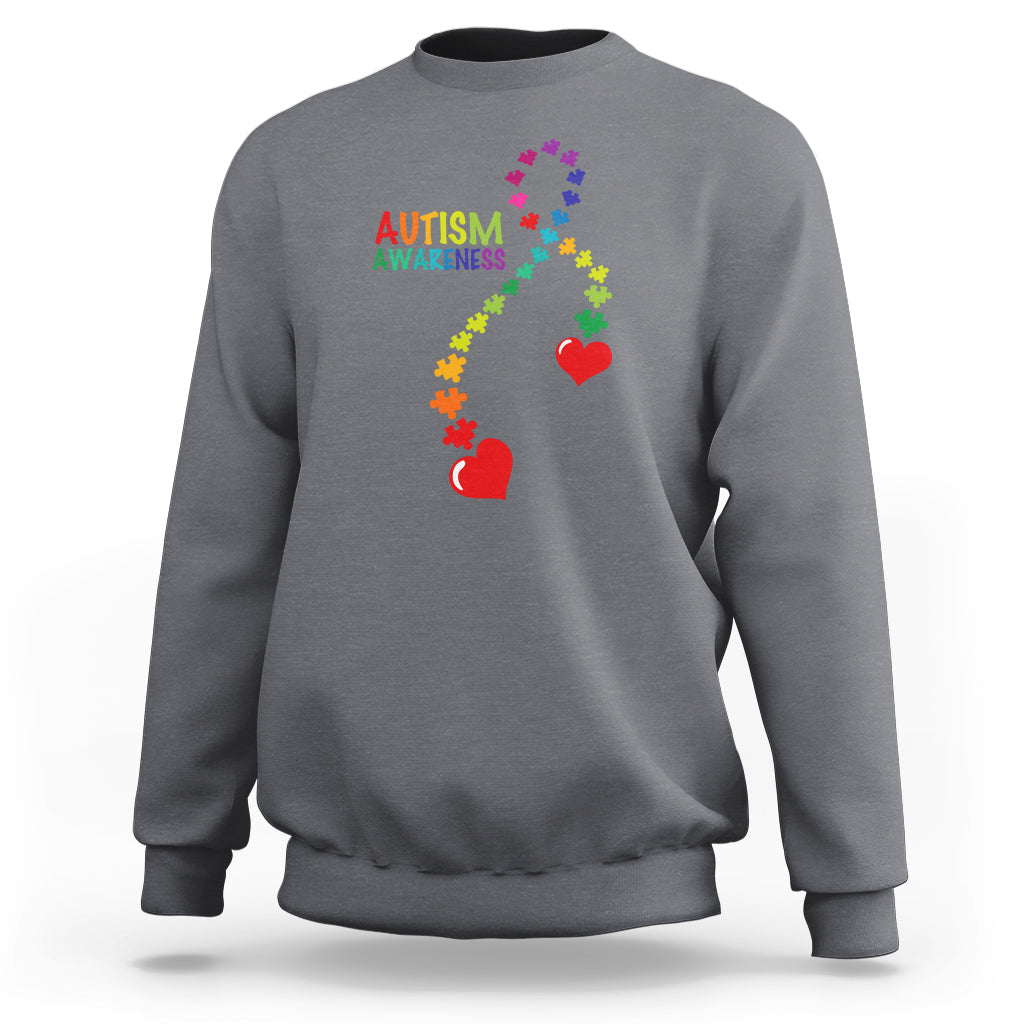 Dark heather gray sweatshirt with autism awareness puzzle heart and ribbon graphic.