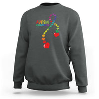 Charcoal gray sweatshirt with autism awareness puzzle heart and ribbon graphic, crewneck.