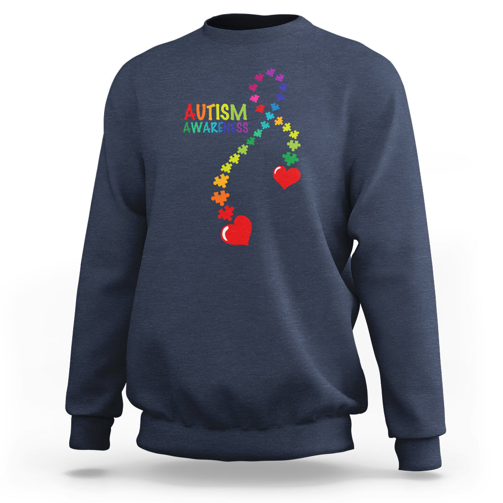Navy sweatshirt with autism awareness puzzle heart and ribbon graphic, crewneck.