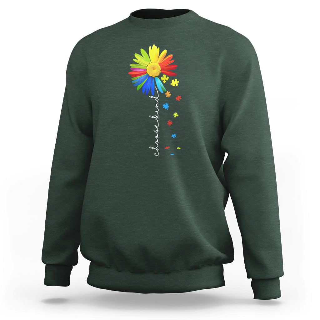 Dark green crewneck sweatshirt with colorful sunflower and rainbow puzzle graphic on chest