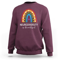 Maroon crewneck sweatshirt with rainbow arch and 'NEURODIVERSITY is beautiful' text