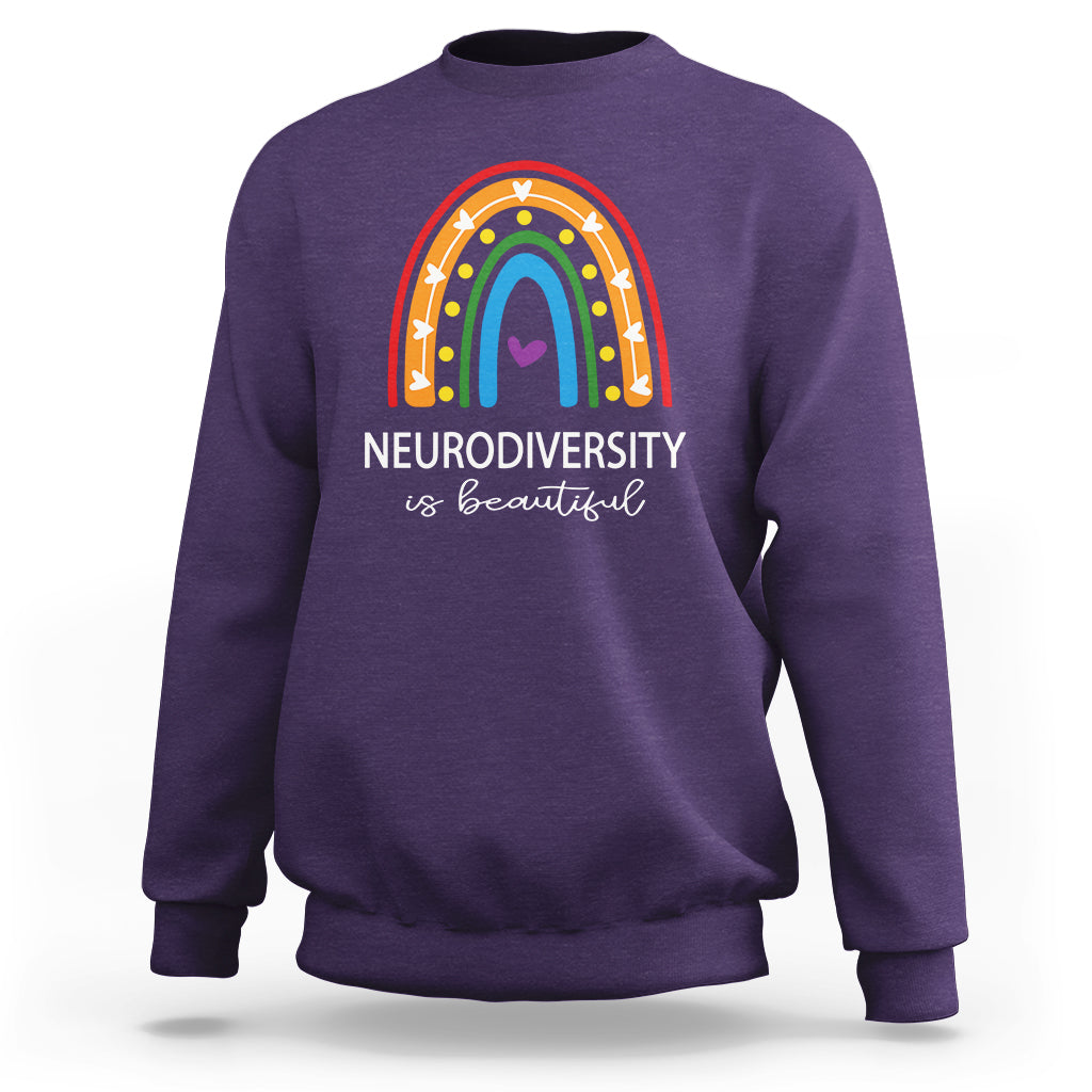 Purple crewneck sweatshirt with rainbow arch and 'NEURODIVERSITY is beautiful' text