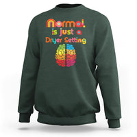 Dark forest green autism sweatshirt with rainbow text 'normal is just a Dryer Setting' and brain graphic