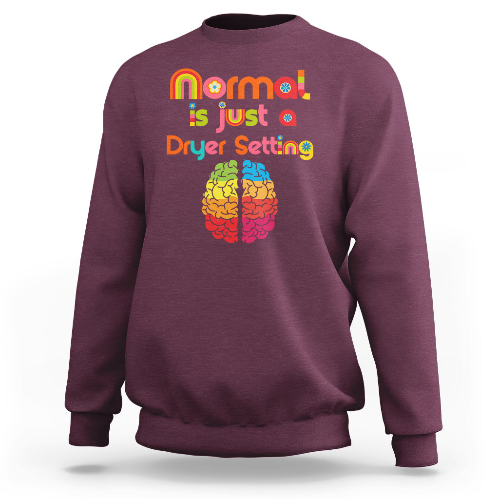 Maroon autism sweatshirt with rainbow text 'normal is just a Dryer Setting' and brain graphic