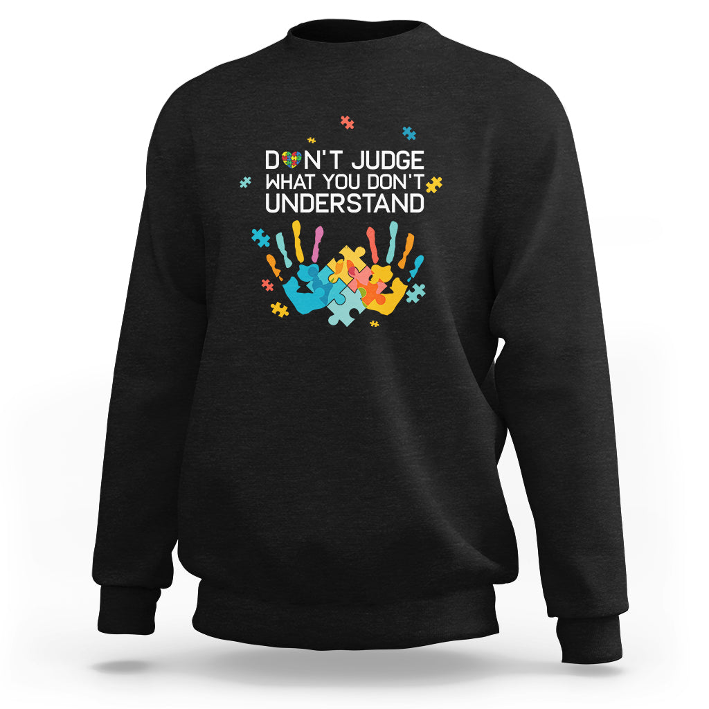 Dark charcoal sweatshirt with 'Don't judge what you don't understand' puzzle graphic