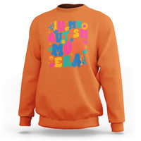 Orange autism mom sweatshirt with colorful autism text and puzzle graphic