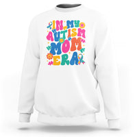 White autism mom sweatshirt with colorful autism text and puzzle graphic