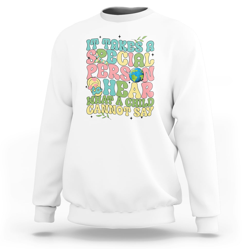 White autism awareness sweatshirt with colorful “what a child cannot say” graphic