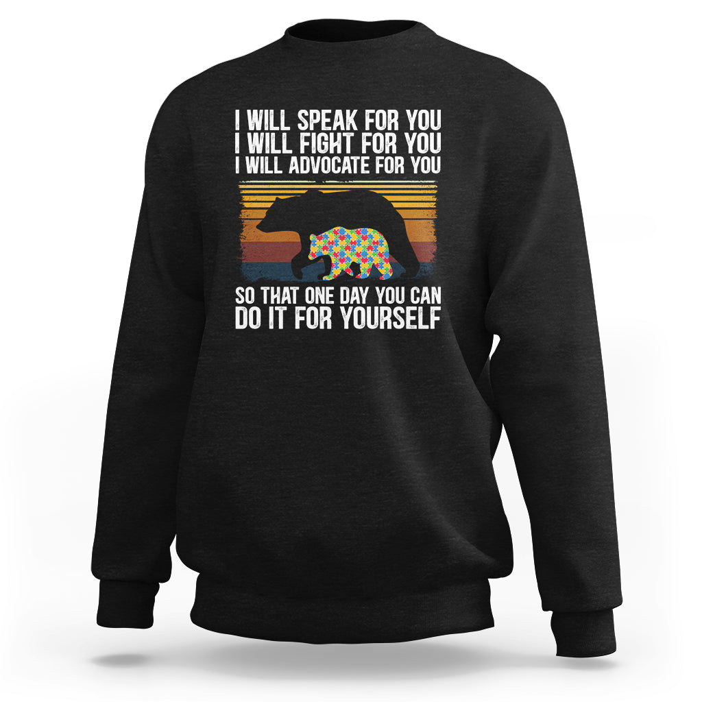 Crewneck sweatshirt in black with front message text and colorful bear graphic