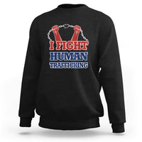 Black sweatshirt with 'I FIGHT HUMAN TRAFFICKING' graphic and fist chain