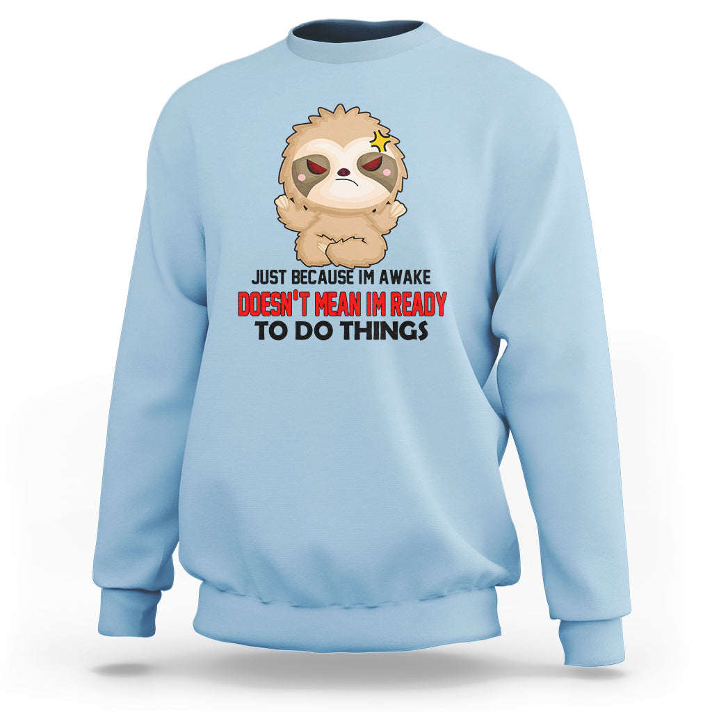 Light blue sweatshirt with cartoon sloth face and bold slogan graphic, crewneck pullover