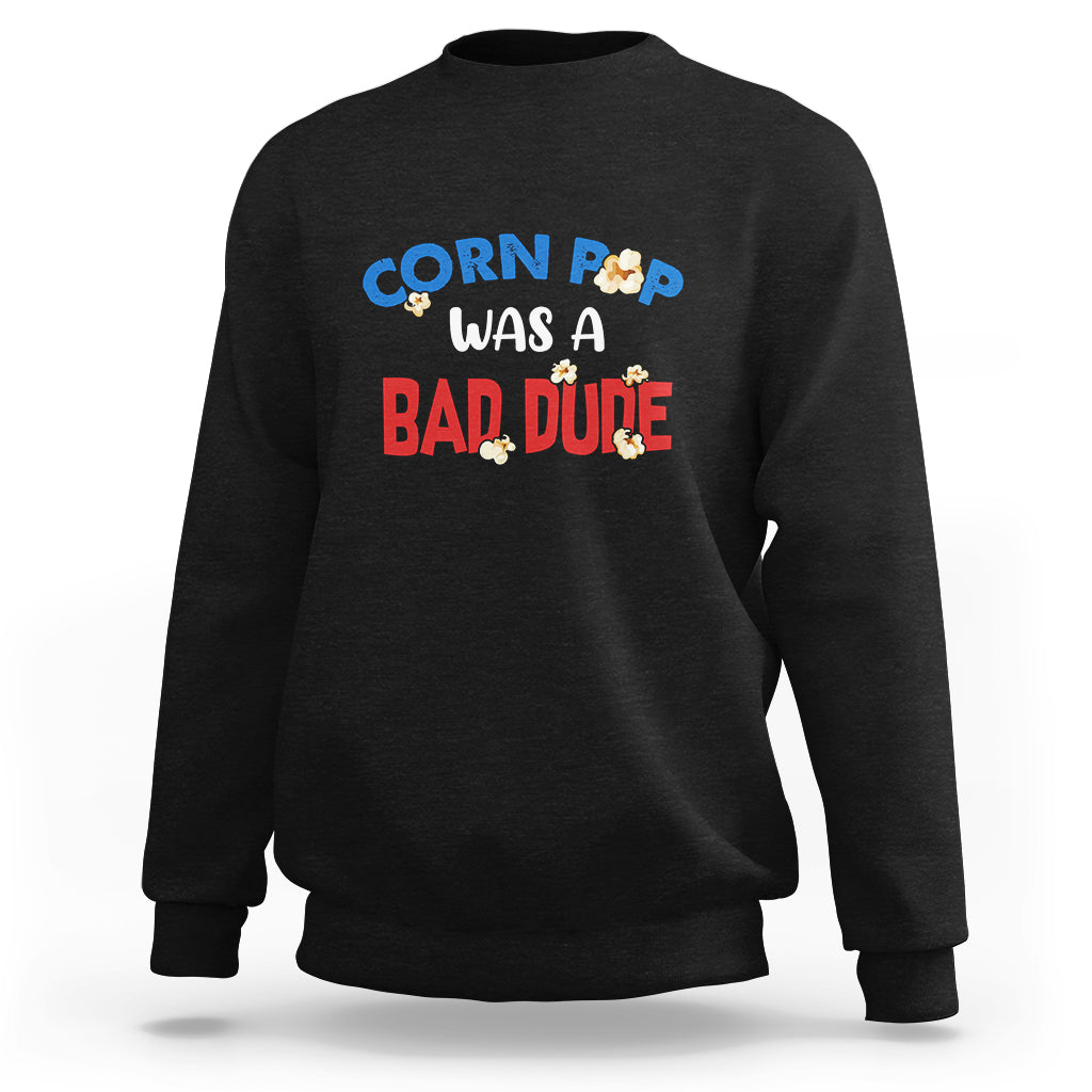 Black sweatshirt with “Corn Pop was a bad dude” graphic on the chest