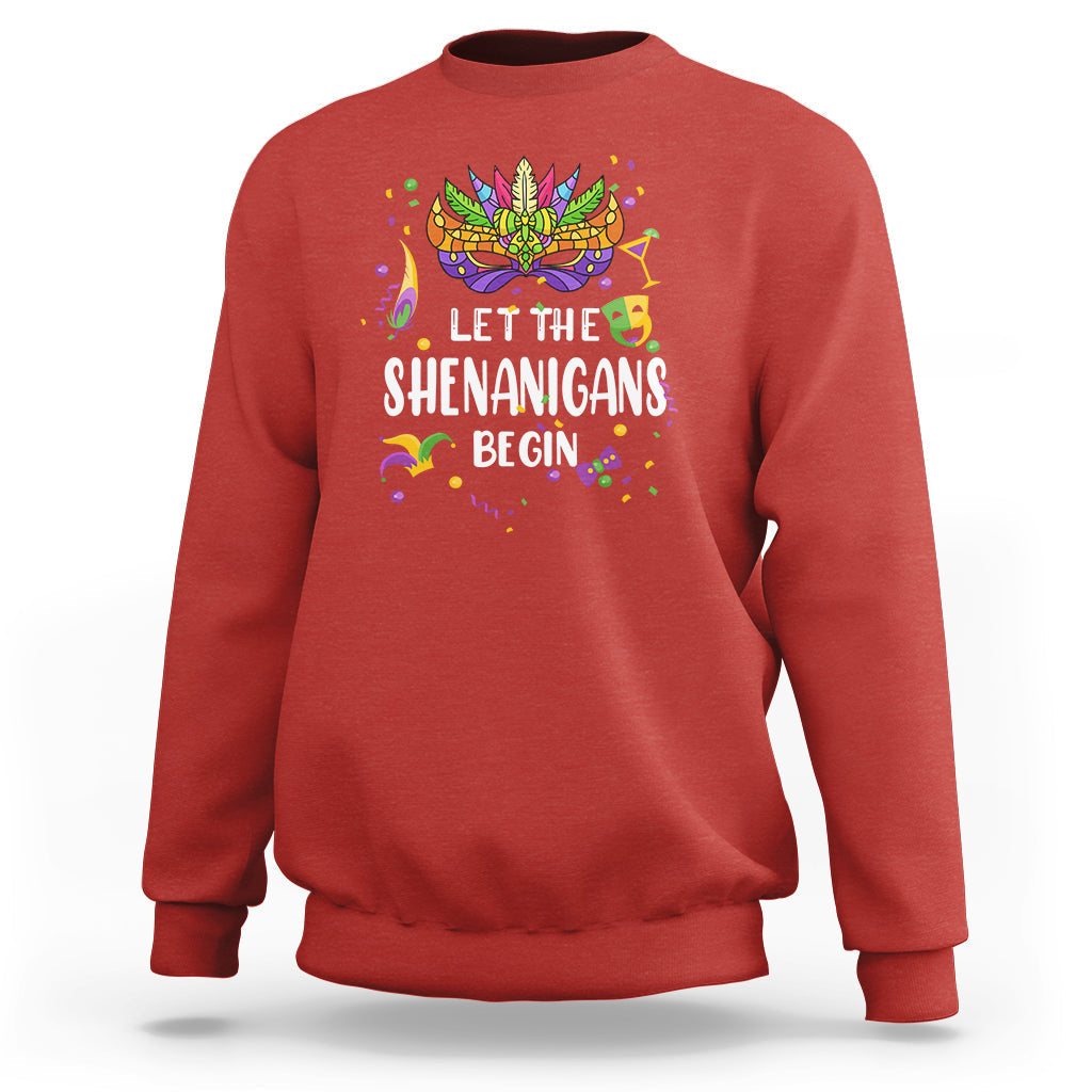 Women’s red sweatshirt with colorful Mardi Gras mask and “Let the Shenanigans Begin” text