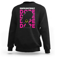 Black sweatshirt with 'UNAPOLOGETICALLY DOPE' graphic of woman profile in pink and yellow