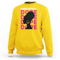 Daisy yellow sweatshirt with 'UNAPOLOGETICALLY DOPE' graphic of woman profile in pink and yellow