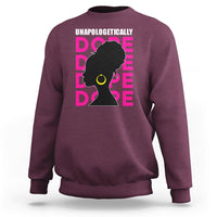 Maroon sweatshirt with 'UNAPOLOGETICALLY DOPE' graphic of woman profile in pink and yellow