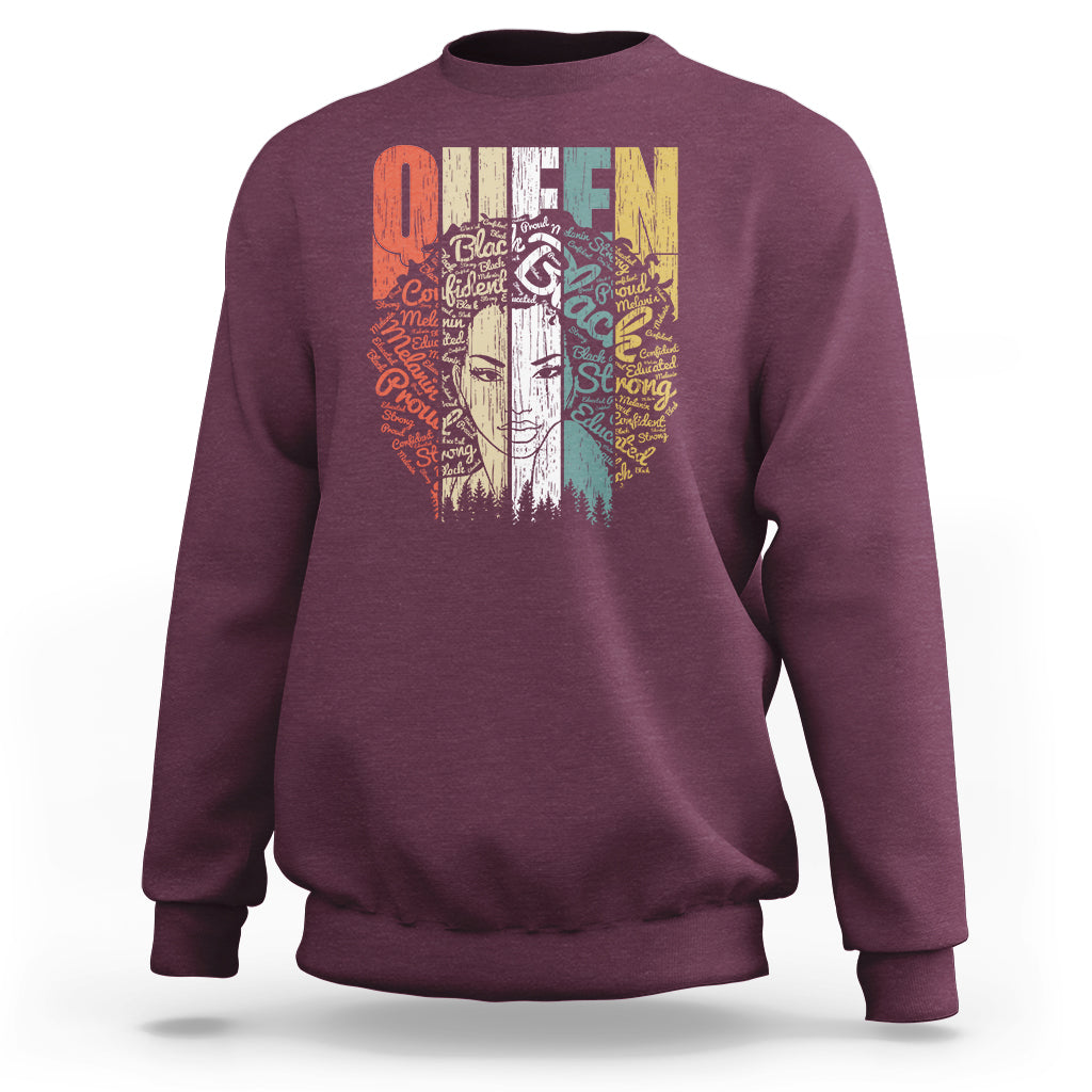 Maroon women’s sweatshirt with Queen graphic on back, crew neck, long sleeves