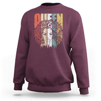 Maroon women’s sweatshirt with Queen graphic on back, crew neck, long sleeves
