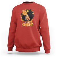 Red crewneck sweatshirt with front portrait graphic and floral wreath