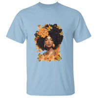 Women's light blue graphic T-shirt with curly-haired woman and floral art print