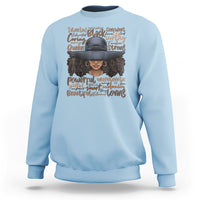 Ladies Juneteenth sweatshirt in light blue with colorful portrait graphic and text on front