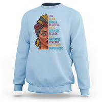 Light blue crewneck sweatshirt with woman face graphic and vertical inspirational text.
