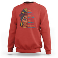 Red crewneck sweatshirt with woman face graphic and vertical inspirational text.