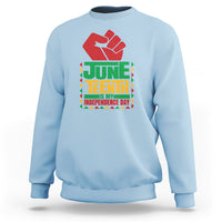 Light blue crewneck sweatshirt with red hand graphic and Juneteenth independence text