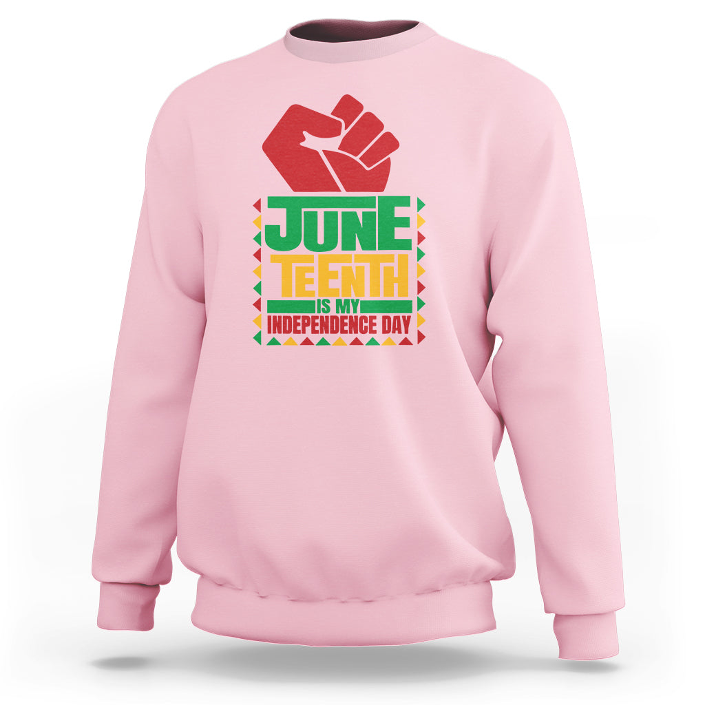 Light pink crewneck sweatshirt with red hand graphic and Juneteenth independence text