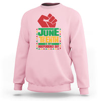 Light pink crewneck sweatshirt with red hand graphic and Juneteenth independence text