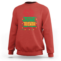 Red crewneck sweatshirt with red hand graphic and Juneteenth independence text