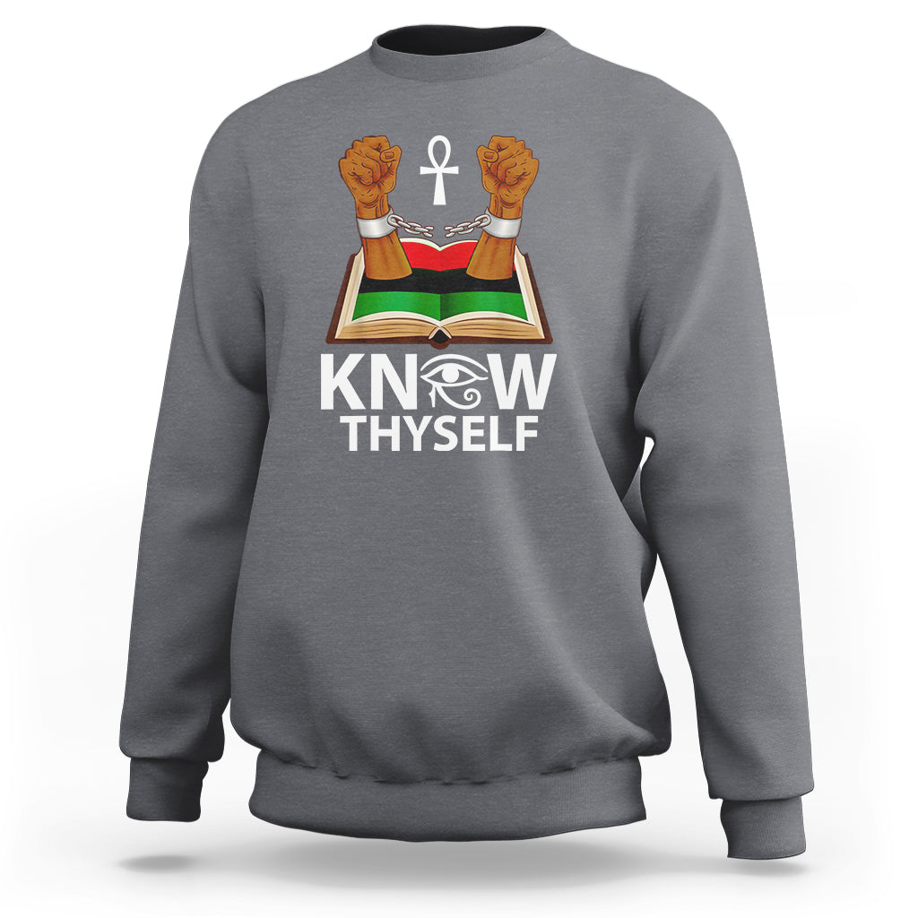Charcoal crewneck sweatshirt with 'KNOW THYSELF' graphic featuring open book, cross, hands
