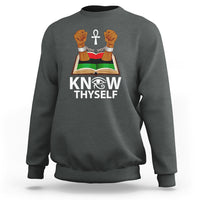 Dark heather gray crewneck sweatshirt with 'KNOW THYSELF' open book, cross, raised hands