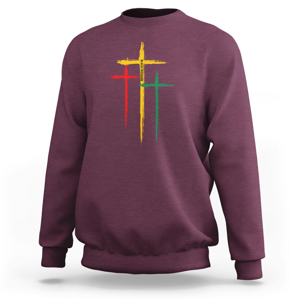 Maroon crewneck sweatshirt with multicolor cross graphic on chest