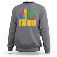 Dark heather crewneck sweatshirt with colorful "FREE-ISH SINCE 1865" front graphic