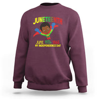 Maroon crewneck sweatshirt with Juneteenth graphic and superhero boy front print