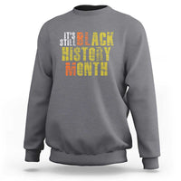Dark heather gray crewneck sweatshirt with “Black History Month” graphic on chest