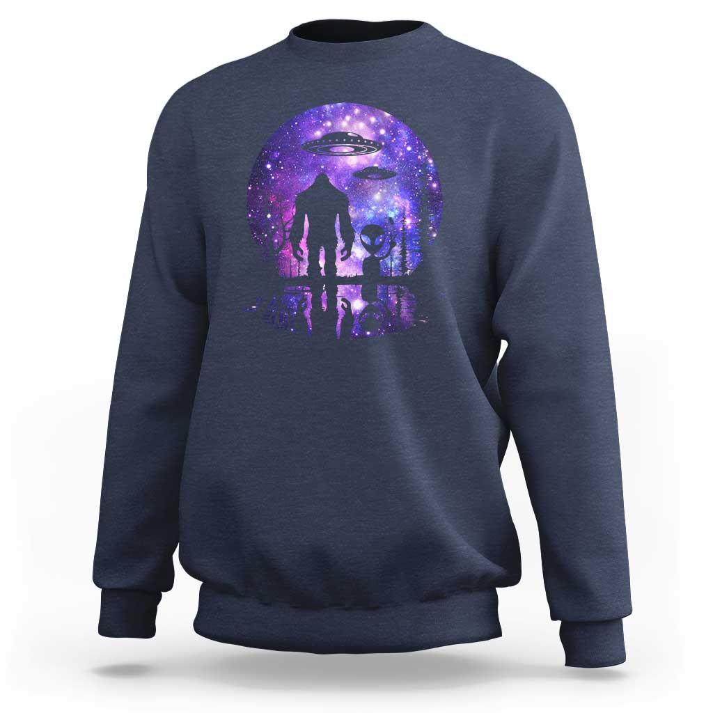 Crewneck sweatshirt in navy blue with galaxy full-moon alien and Bigfoot UFO graphic.