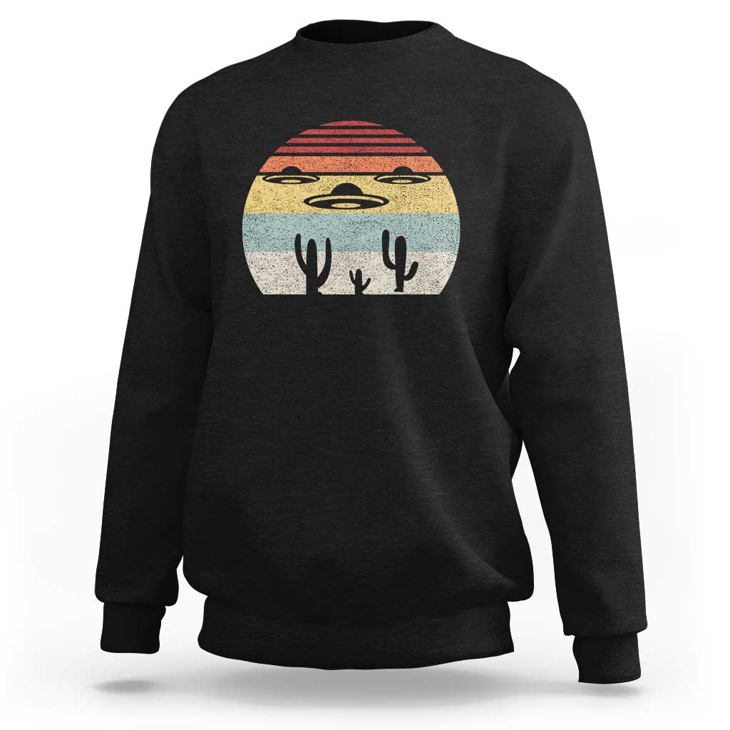 Black crewneck sweatshirt with vintage UFO and alien graphic on chest
