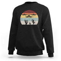 Black crewneck sweatshirt with vintage UFO and alien graphic on chest