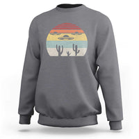 Dark heather gray crewneck sweatshirt with vintage UFO and alien graphic on chest