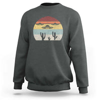Charcoal crewneck sweatshirt with vintage UFO and alien graphic on chest