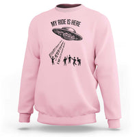 Light pink crewneck sweatshirt with alien UFO graphic and abduction silhouettes