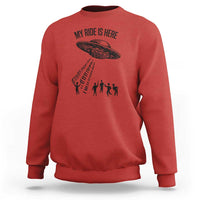 Red crewneck sweatshirt with alien UFO graphic and abduction silhouettes