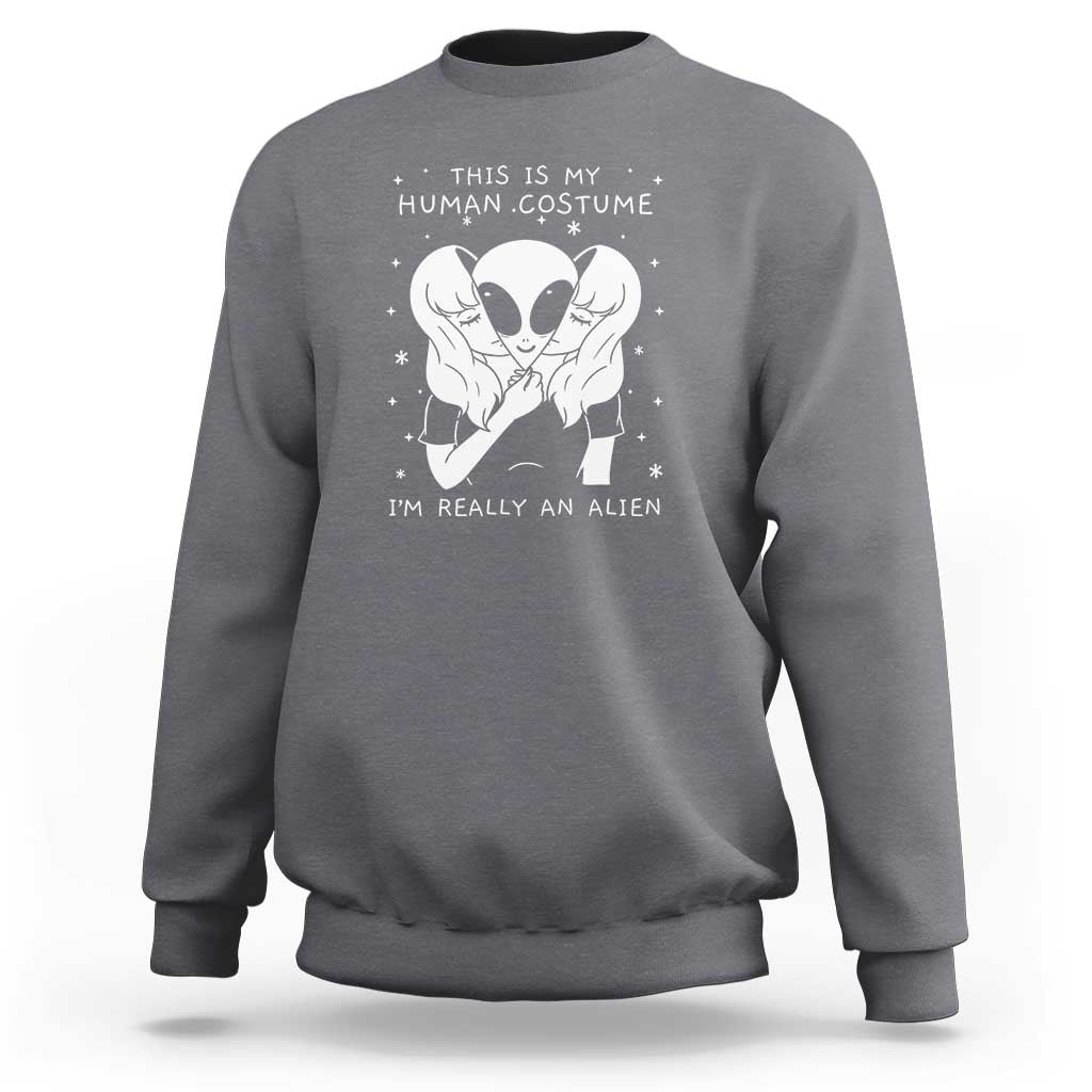 Charcoal gray crewneck sweatshirt with alien face graphic and “I’m really an alien” print.