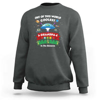 Men's charcoal crewneck sweatshirt with colorful space-themed alien and UFO graphic on chest