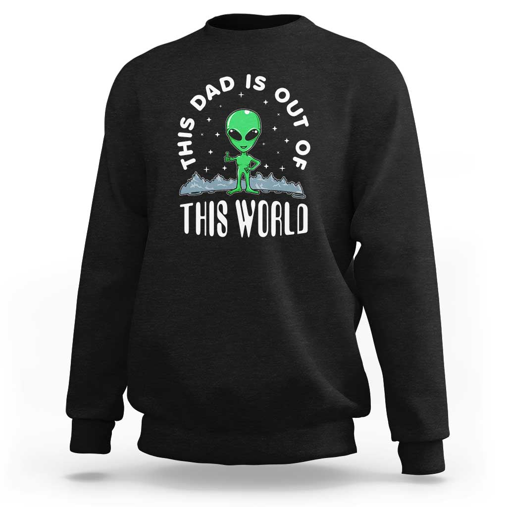 Black dad-style sweatshirt with alien graphic and 'THIS WORLD' front print