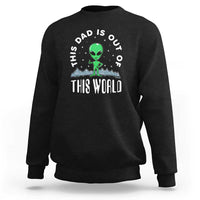 Black dad-style sweatshirt with alien graphic and 'THIS WORLD' front print